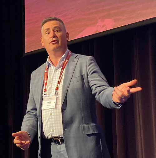 Mark Perry presenting on stage at Ping Identity event